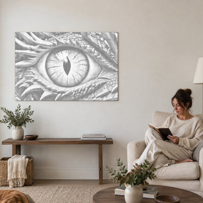 Dot-painting canvas “Dragon Eye”, on a living-room wall with a person reading in an armchair nearby.