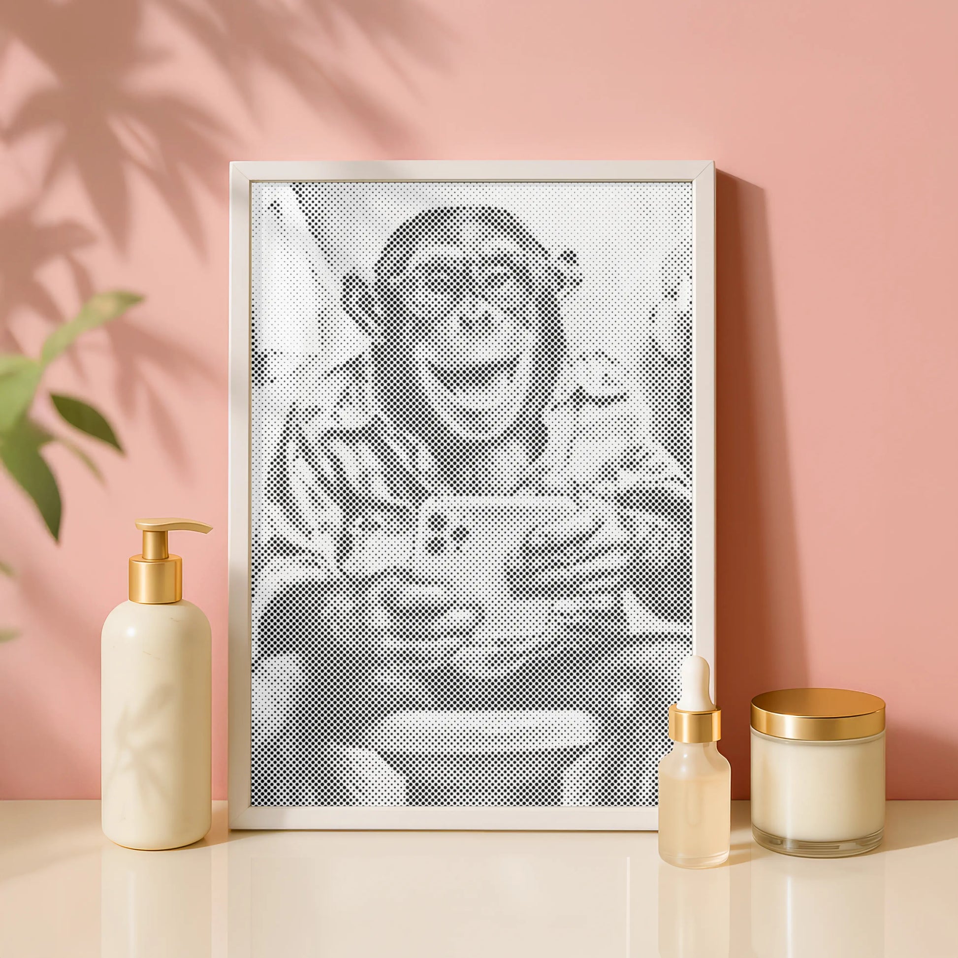 Framed artwork of a monkey holding a smartphone on a pink wall with decorative items. Laughing Monkey with Selfie | Dot Painting Kit