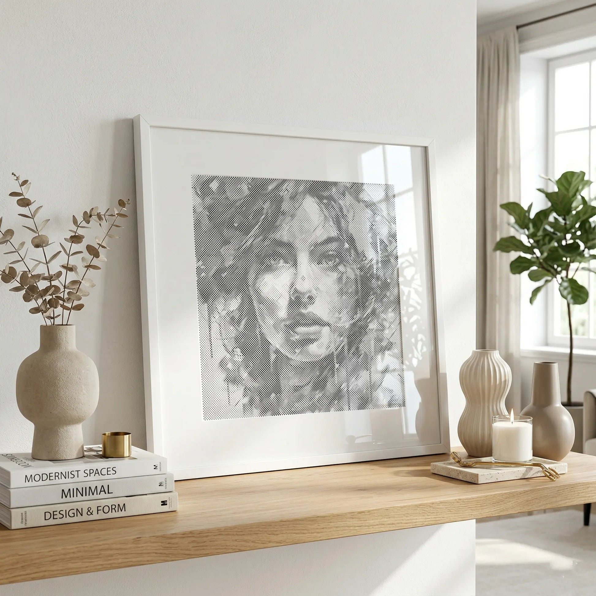 Framed artwork of a woman's face on a wooden shelf with decor items in a bright room. Modern Woman Portrait | Dot Painting Kit