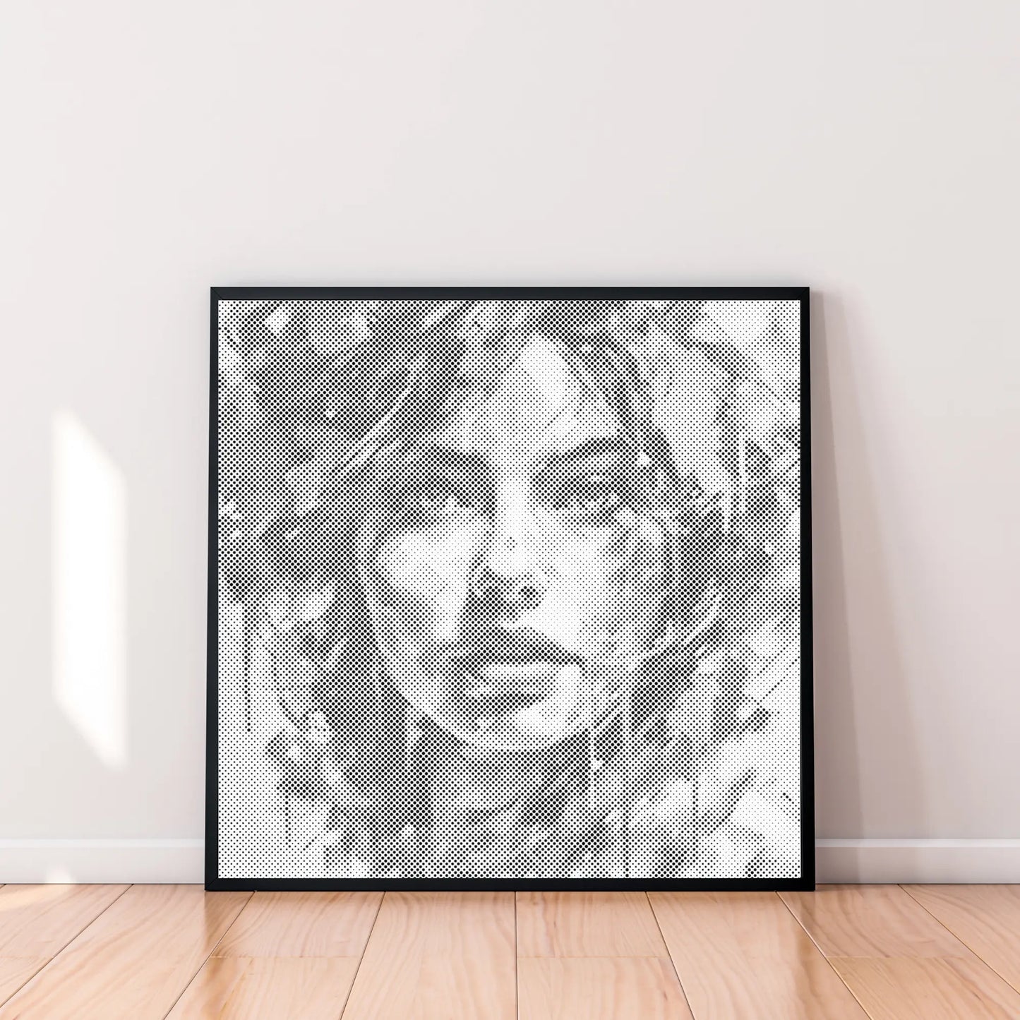 Framed black and white abstract art print on a white wall. Modern Woman Portrait | Dot Painting Kit