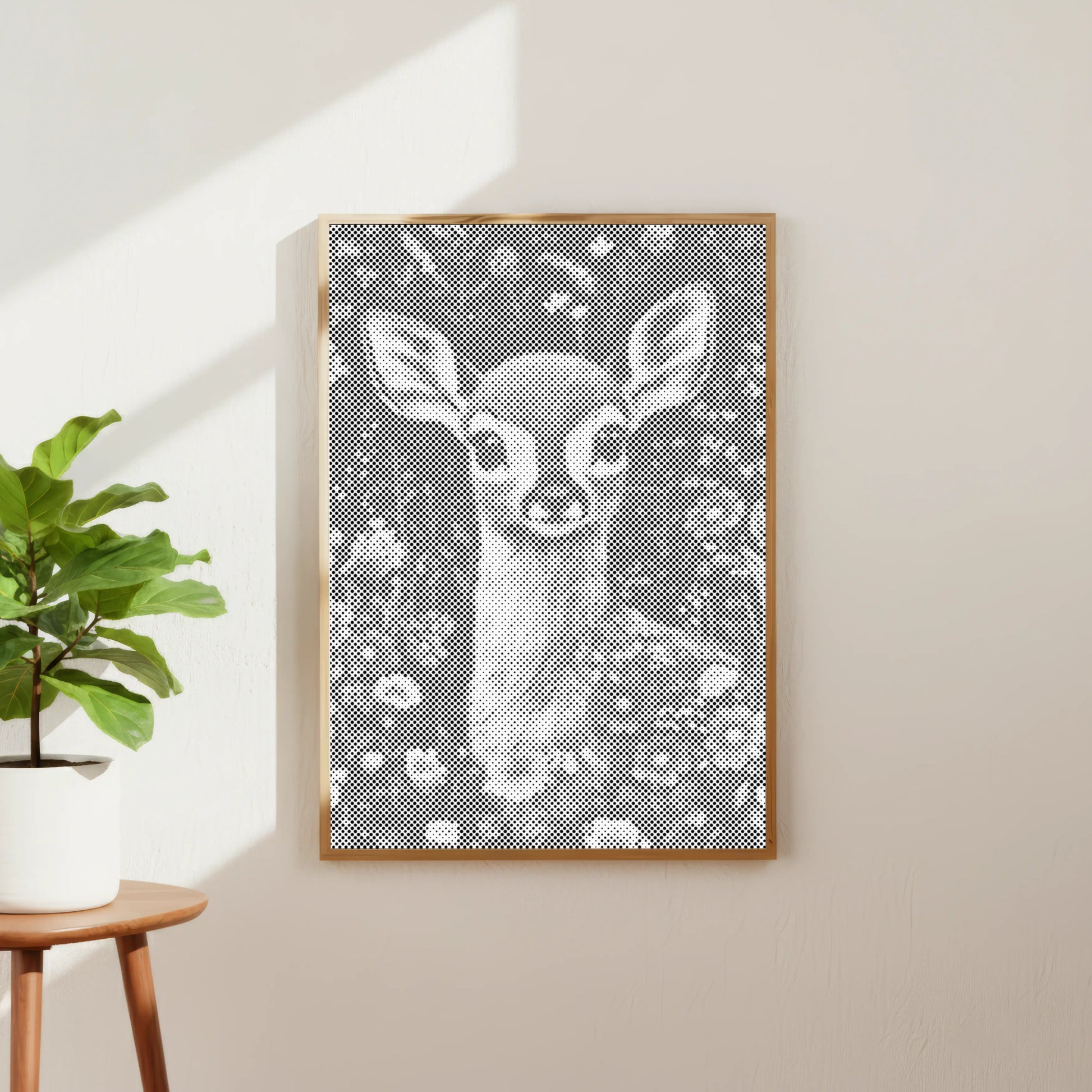 Framed artwork of a deer in a floral pattern on a wall next to a plant. Dot Painting Kit Fawn – Quiet Meadow | Paint by Dots