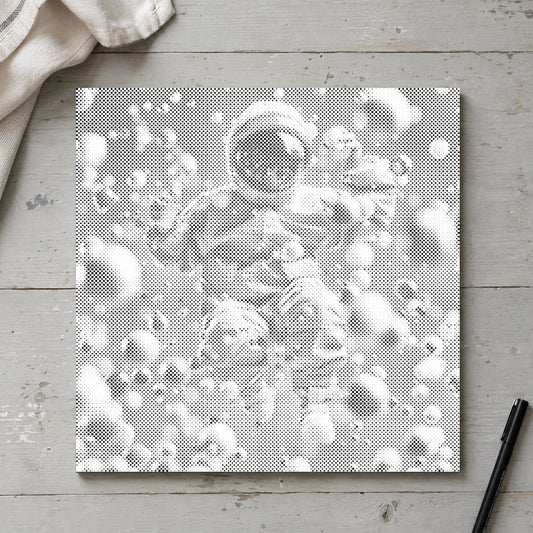 Dot-painting canvas “Abstract Astronaut”, seen from above on a worktable in soft daylight.