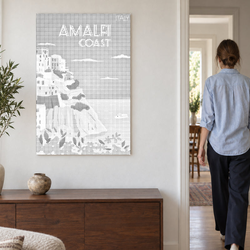Dot-painting canvas “Amalfi Coast”, on a light wall with a person walking through the doorway nearby.