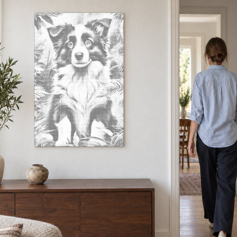 Dot-painting canvas “Border Collie Puppy”, on a light wall with a person walking through the doorway nearby.