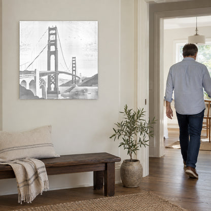Dot-painting canvas “Golden Gate Bridge”, on a light wall with a person walking through the doorway nearby.