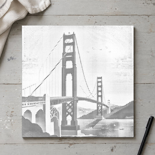 Dot-painting canvas “Golden Gate Bridge”, seen from above on a worktable in soft daylight.