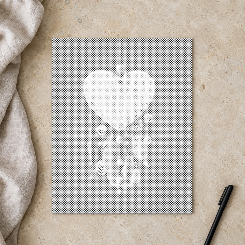 Dot-painting canvas “Heart Shaped Dreamcatcher”, seen from above on a worktable in soft daylight.