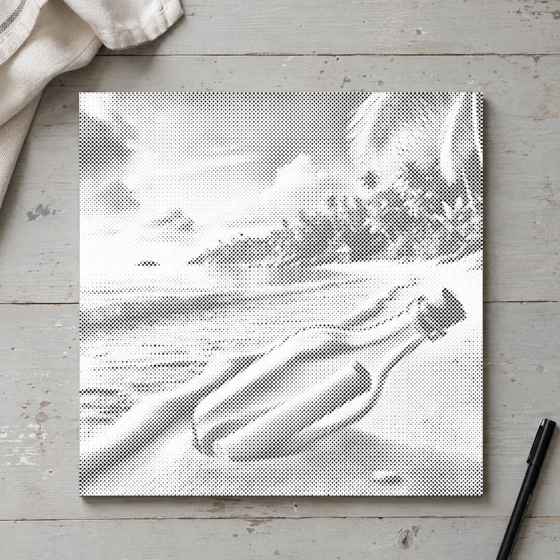 Dot-painting canvas “Message in a Bottle”, seen from above on a worktable in soft daylight.