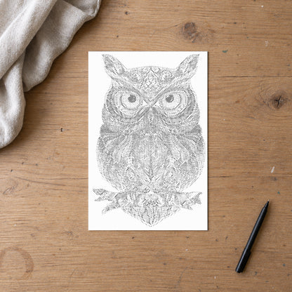 Dot-painting canvas “Owl Mandala”, seen from above on a worktable in soft daylight.