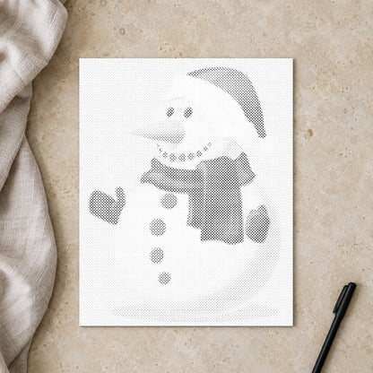 Dot-painting canvas “Snowman”, seen from above on a worktable in soft daylight.