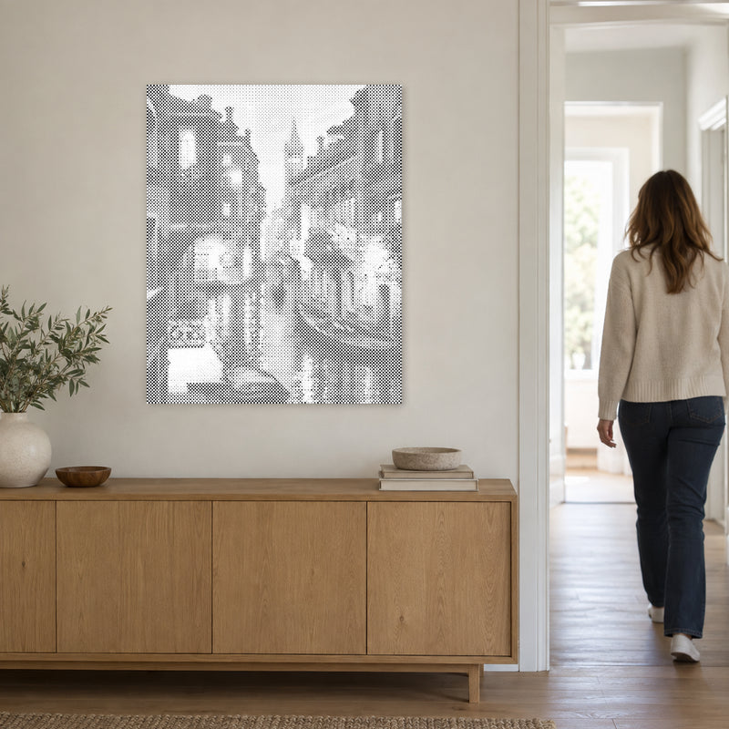 Dot-painting canvas “Venice at Night”, on a light wall with a person walking through the doorway nearby.